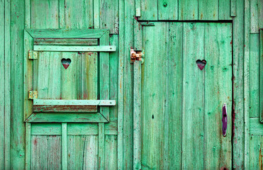 Fototapeta na wymiar old green wooden doors and window