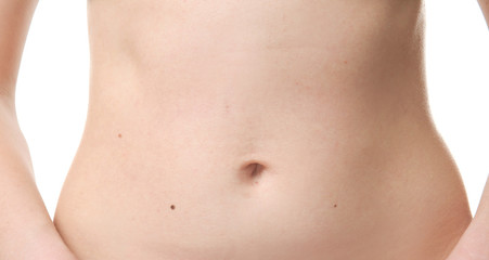 Fototapeta na wymiar Young woman's belly, closeup