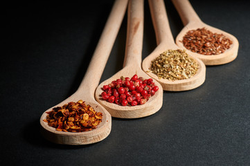 Various of spices in wooden spoons