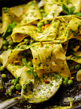 Close-Up Of Pappardelle Pasta With Peas, Pesto, Mint And Cheese In Pan.