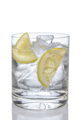 Cocktail gin and tonic with lemon and ice isolated on white.