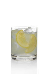 Cocktail martini and tonic with lemon and ice isolated on white.
