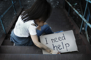 Poor woman begging for help on the street
