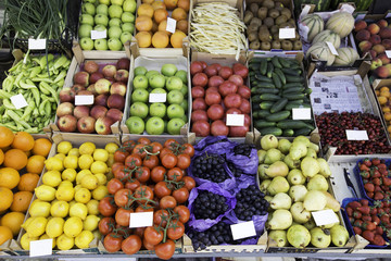 Big assortment of fresh organic fruits. Frame composition of fruits on market stall