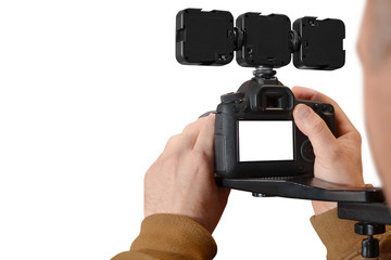 Fototapeta premium Man using camera for recording, isolated on white background