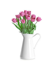 Vase with beautiful bouquet of lilac tulips on white background