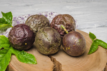 Passion fruits on wooden background