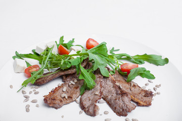 veal with arugula and tomatoes;