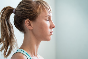 Young woman relaxing with closed eyes