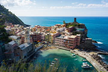 Colorfull Cinque Terre Vernazza turistic harbor view in sunny summer day in Italy