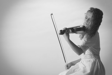 Musician violinist woman playing on violin