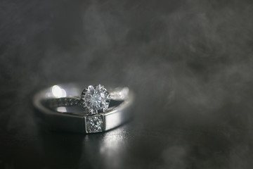 wedding ring on hand in smoke