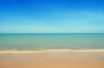 Fototapeta na wymiar Wave & Sand beach with blue sky background 
