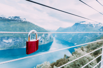 Red padlock and Geirangerfjord from Flydasjuvet viewpoint Norway