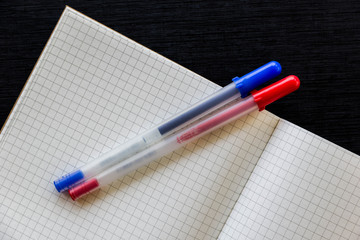 Notebook and pens background