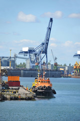 Naklejka premium Tugboat and port cargo crane