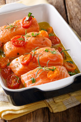 Slow Baked Salmon and Cherry Tomatoes in olive oil. Vertical