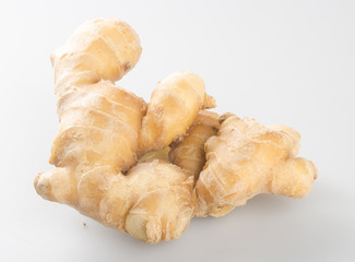 Ginger or fresh ginger on a background.