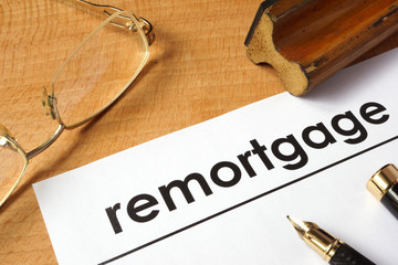 Page of paper with remortgage on a table.