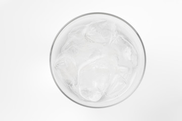 glass of soda with ice blocks isolated on white background, top view