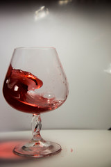 A glass of red wine in motion