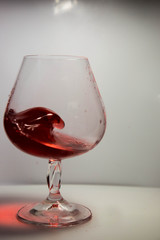 A glass of red wine in motion