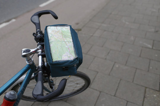 road map attached to small bag on the steer of a bike