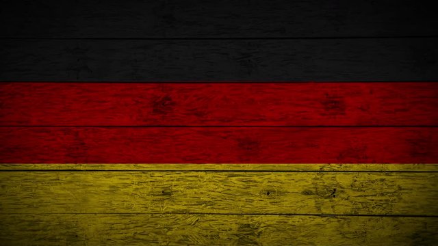 Painting flag of Germany on old wood boards