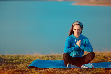 Girl Relaxing on Yoga Mat in Nature