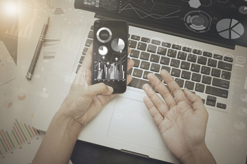 business working on office table with smart phone and digital strategy graph business with social media diagram.