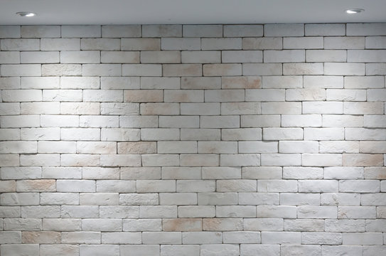 Brick wall background and two light by lamp