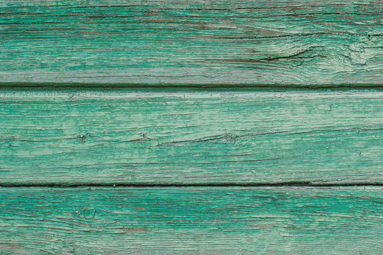 The background picture of the old green wooden Board. Texture.