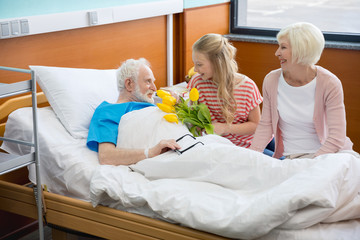 grandmother and granddaughter visiting patient