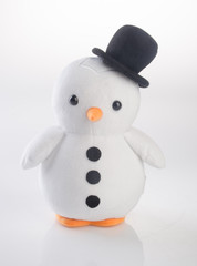 toy or funny handmade toy penguins on background.