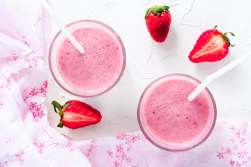 Milk cocktail with strawberries, top view