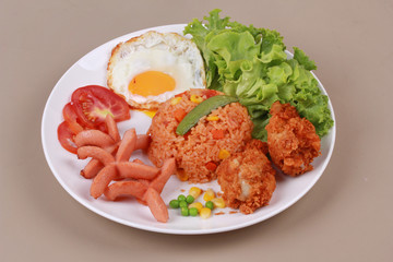 American fried rice topped sunny up,sausage.chicken and herbs