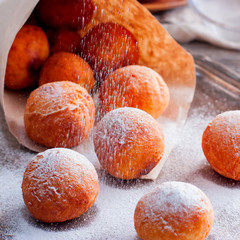 Donuts of cottage cheese in a paper bundle, square