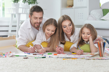 Happy parents with children  at home