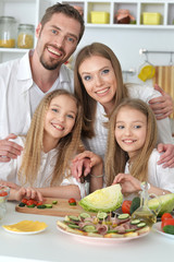 Happy parents with children  at home
