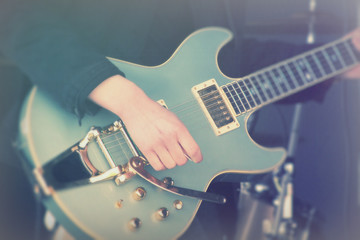 Close up of man playing a guitar