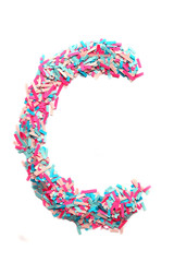 letter C made of colored pieces of paper isolated on white background