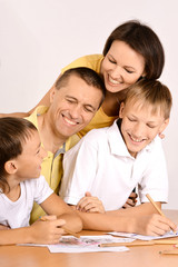 Happy parents with children  at home