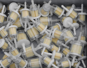 A pile of plastic in-line petrol filters