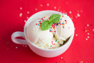 Ice cream in a cup on a red background