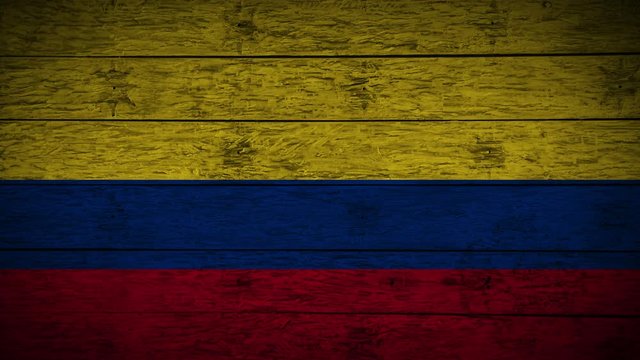 Painting flag of Colombia on old wood boards
