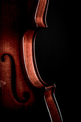 Violin musical instruments of orchestra closeup on black