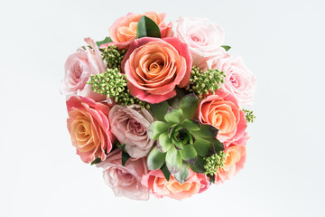 Close-up view of beautiful bouquet of roses and succulents isolated on white