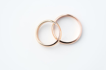 two golden wedding rings isolated on white, wedding rings background concept - obrazy, fototapety, plakaty