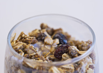 Granola with yogurt in glass cup
