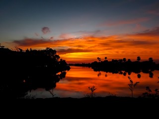 Sunset behind the pond